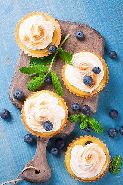 istock Mini lime curd tartlets with meringue. 477272684