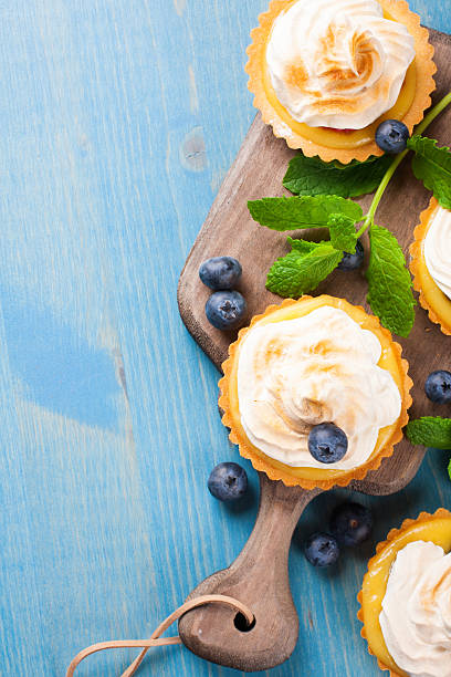 istock Mini lime curd tartlets with meringue. 477272686