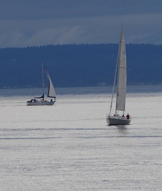 istock Sail boats under cloudy skies 477272718