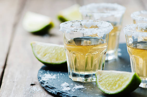 istock Gold tequila with lime and salt 477273182