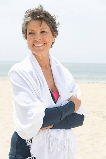 istock Woman Wrapped With Stole At Beach 477274333