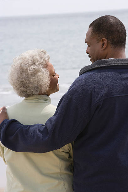 istock Mother And Son Looking At Each Other ON Beach 477274425