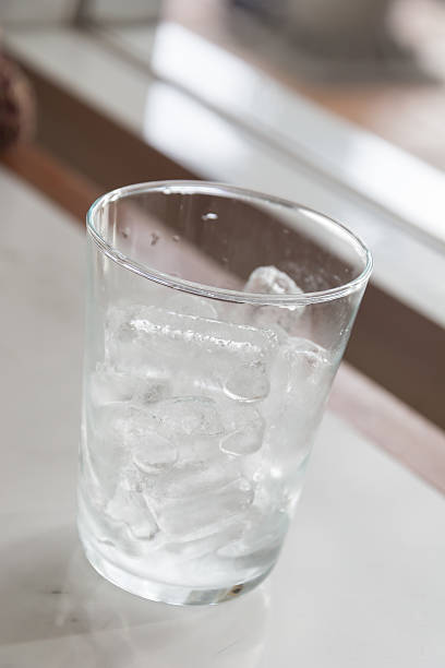 istock Glass of pure water with ice 477276326
