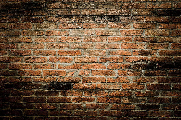 istock red brick wall texture grunge background with vignetted corners 477284694