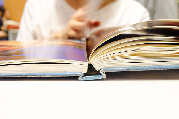istock girl open next page of the book 477284816