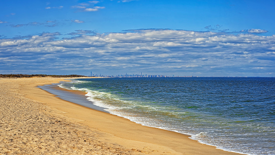 Ocean shore and view to NYC from Sandy Hook, NJ at windy weather