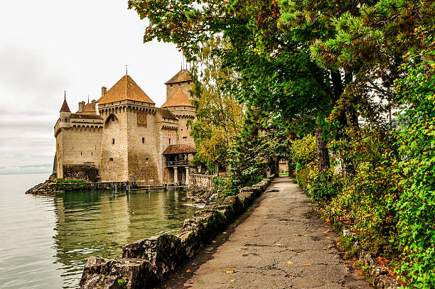 Footpath to Chillon Castle, Montreux Montreux, Switzwerland, October 16, 2013, The Chillon Castle on the lake. chateau de chillon stock pictures, royalty-free photos & images