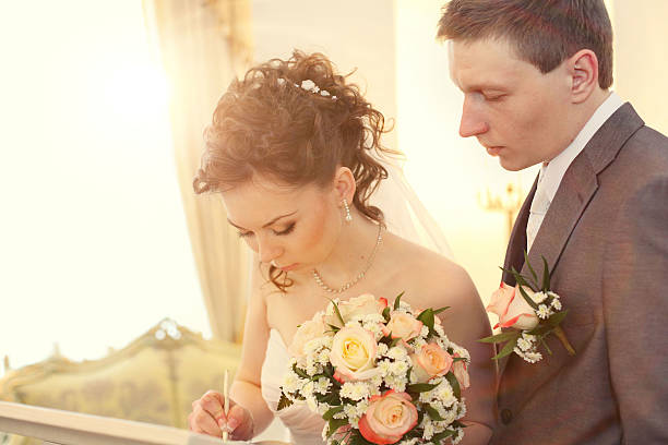istock Bride signing marriage license or wedding contract 477292990