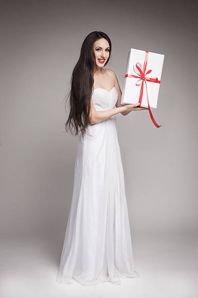 istock Gorgeous woman holding gift 477294381