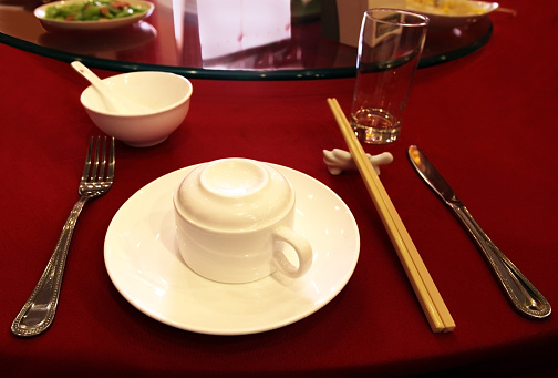 Asia.  China.  Table setting.  Ceramic chopstick rest.