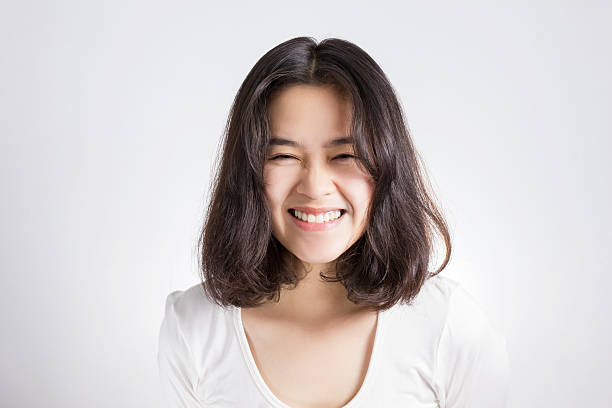 istock Young Asian woman with smiley face. 477296768
