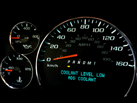 Coolant level low warning light on dashboard
