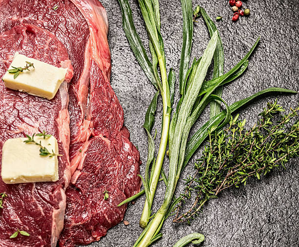 Raw meat with butter, fresh tarragon and thyme