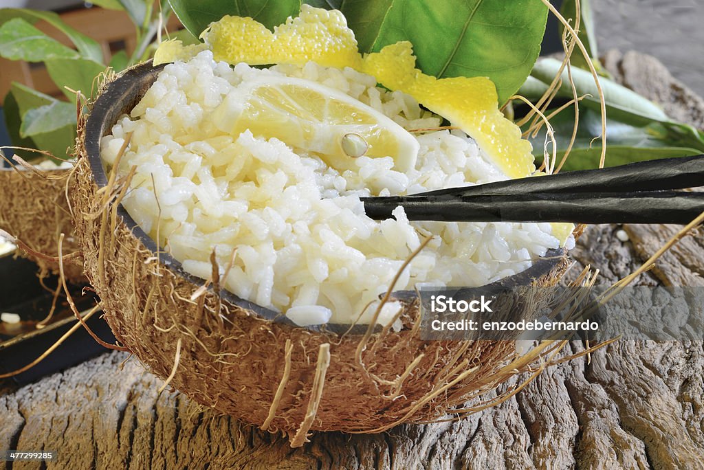 lemon rice boiled rice with lemon juice and fresh coconut in coconut empty Boiled Stock Photo