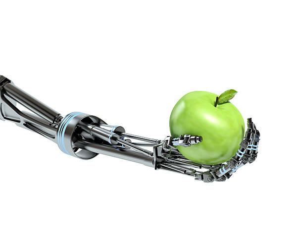 istock Robot hand with green apple on isolated white background 477305060