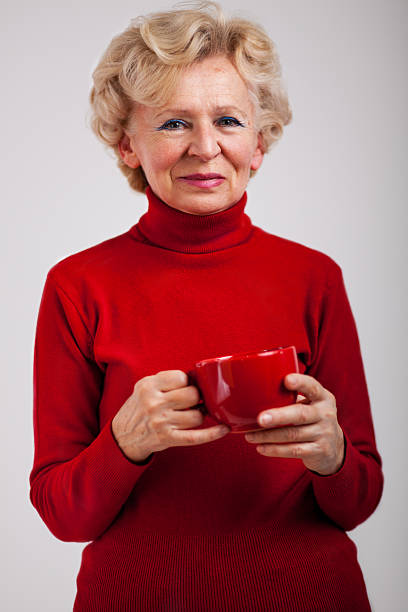 istock Studio Portrait Of Smiling Senior Woman 477310643