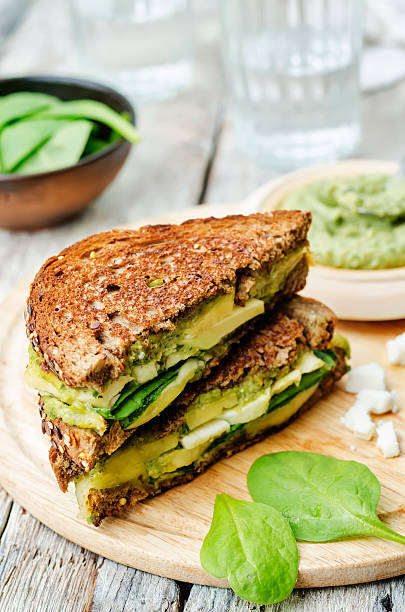 istock grilled rye sandwiches with cheese, spinach, pesto, avocado and goat cheese 477312006