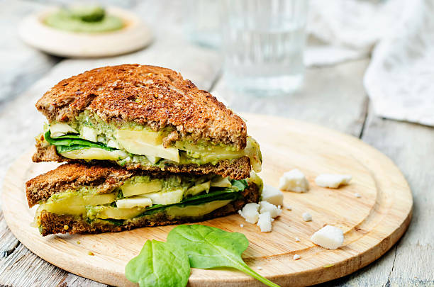 istock grilled rye sandwiches with cheese, spinach, pesto, avocado and goat cheese 477312008