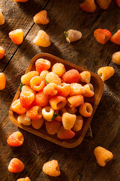 istock Raw Organic Orange Sunshine Raspberries 477314778