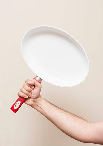 istock Man Holding A Frying Pan 477318054