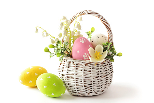 Colorful decorated easter eggs in basket. isolated on white background