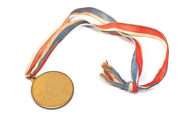 istock Vintage gold sport medal isolated on white 477323547
