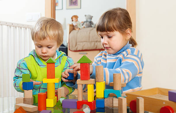 istock tranquil children playing with wooden toys 477328429