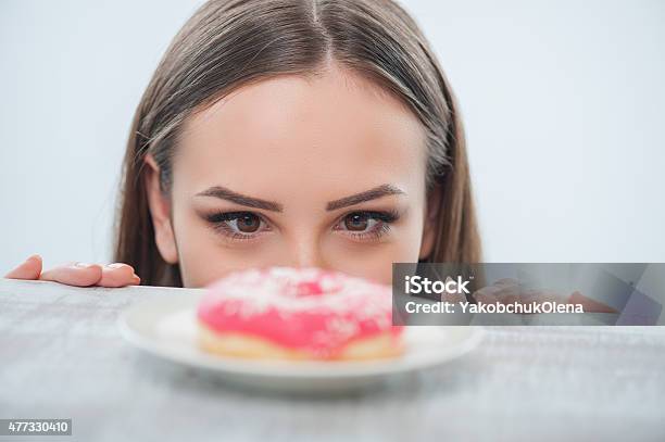 Pretty Young Woman Wants To Eat Sweet Food Stock Photo - Download Image Now - Eating, Women, Cake