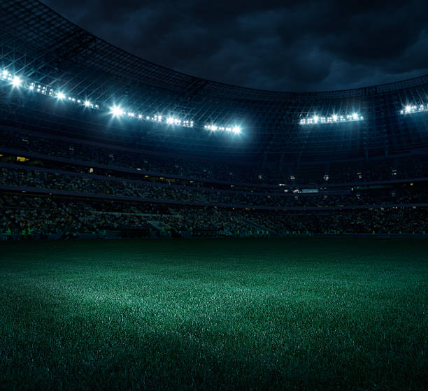 Soccer stadium Dramatic football stadium with dark sky and floodlight international team soccer stock pictures, royalty-free photos & images