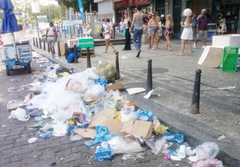 Rio de Janeiro, Brazil - March 04, 2014: Accumulated garbage in the street of the South Zone of Rio de Janeiro neighborhood, during the popular festival of Carnival and public workers strike urban cleaning service