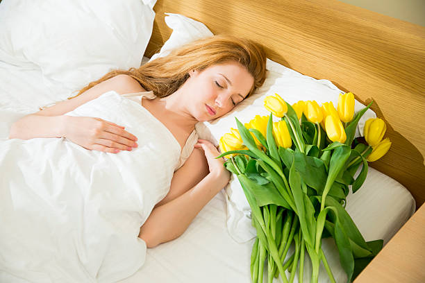 istock Woman sleeping in the bed 477335412