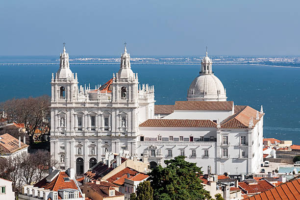 Sao Vicente de Fora Monastery, Lisbon Sao Vicente de Fora Monastery, and the dome of the National Panteon (Santa Engracia church aka Panteao Nacional). Lisbon, Portugal national pantheon lisbon stock pictures, royalty-free photos & images