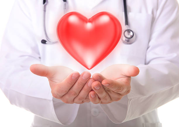 istock Male doctor showing a red heart 477336959