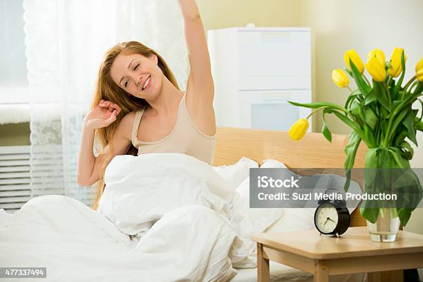 Woman Waking Up In The Bed Stock Photo - Download Image Now - 2015, Adult, Alarm Clock