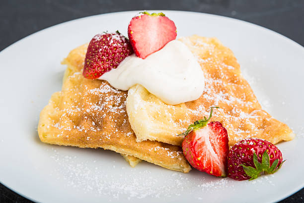 istock Waffles with strawberry and whipped cream 477338390