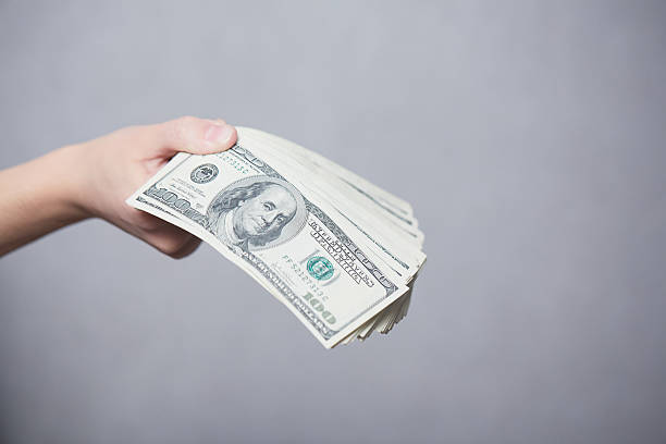 istock Money in female hands 477339418