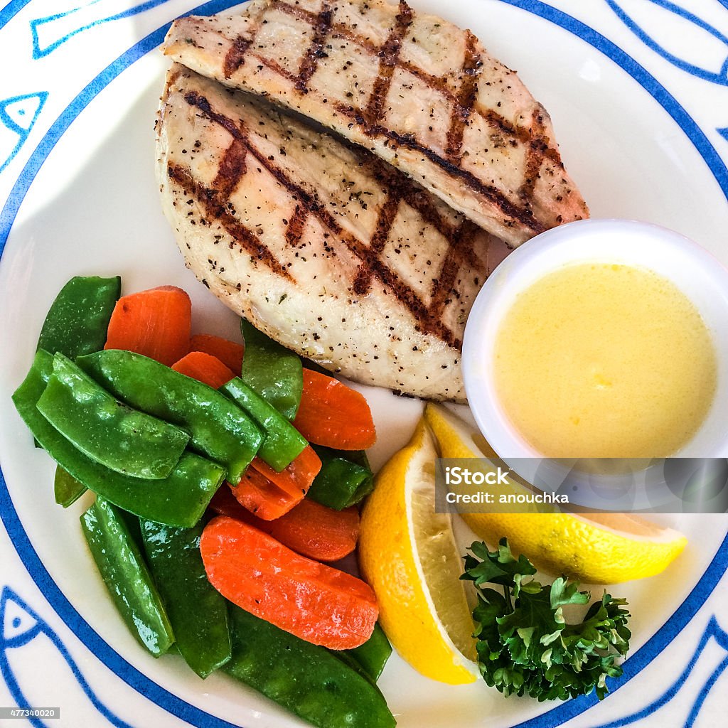 Fish fillet and steamed vegetables on a plate 2015 Stock Photo