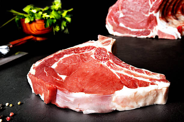 istock Fresh and raw meat. Ribeye. Uncooked steaks grilled BBQ 477342910