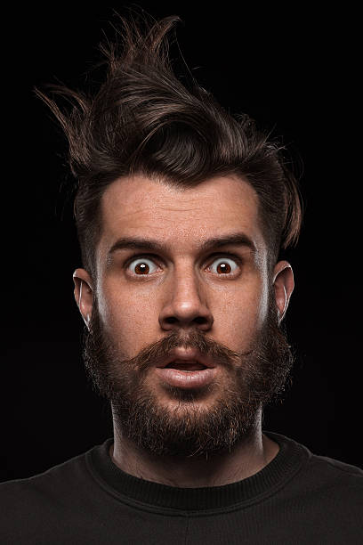 istock Portrait of young tousled man in studio 477343306