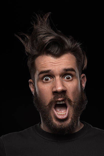 istock Portrait of young tousled man in studio 477343312