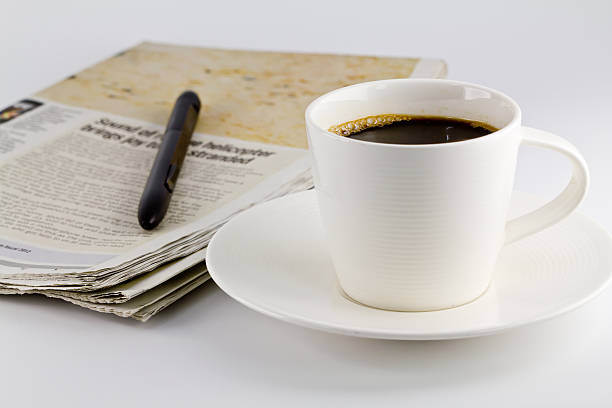 istock cup of coffee and newspaper 477349049