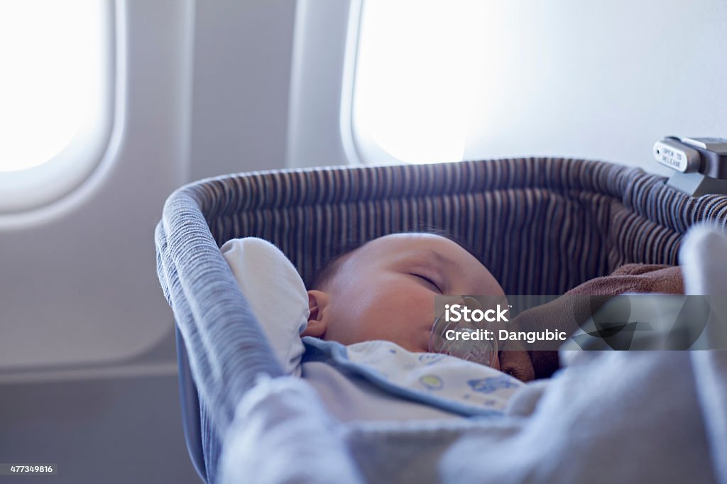 Baby Boy Sleeping In Bassinet On Airplane Adorable Baby Boy Sleeping In Special Bassinet On Airplane Baby - Human Age Stock Photo