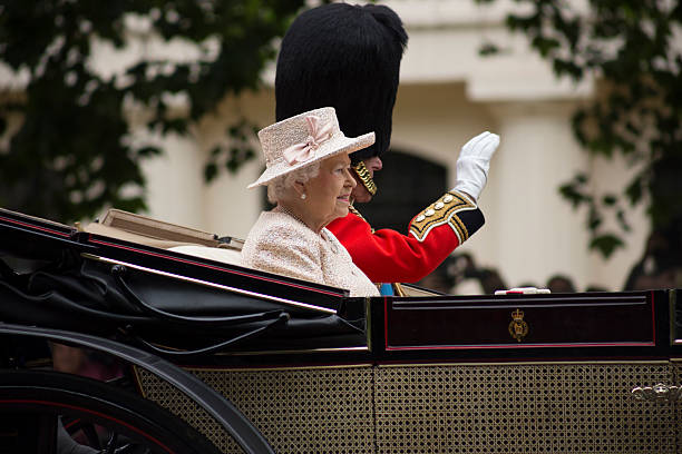 Queen Elizabeth II in an open carriage with Prince Philip London, England - June 13, 2015: Queen Elizabeth II in an open carriage with Prince Philip for trooping the colour 2015 to mark the Queens official birthday, London, UK elizabeth ii photos stock pictures, royalty-free photos & images