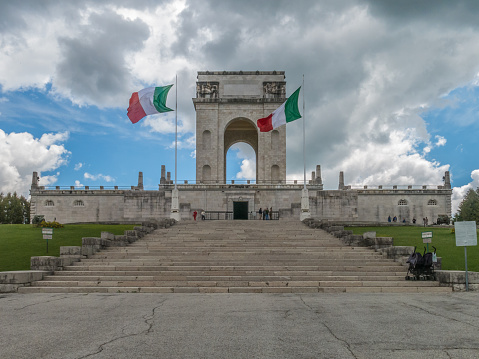 Asiago, Italy - June 1, 2014: Italian flags fly outside the War Memorial in Asiago, Italy