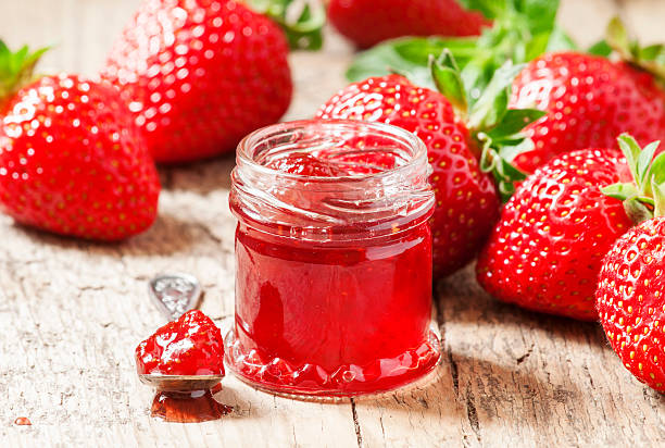 istock Fresh homemade strawberry jam with berries in small jars, select 477354102