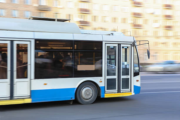 istock bus goes along street 477354122