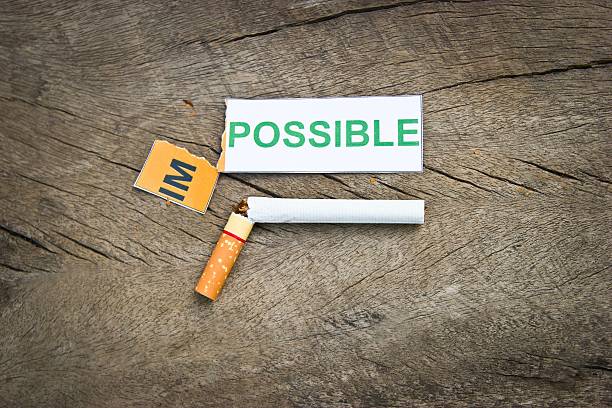 quitting smoking Changing word impossible to possible for quitting smoking concep. (filter image) anti tobacco day stock pictures, royalty-free photos & images