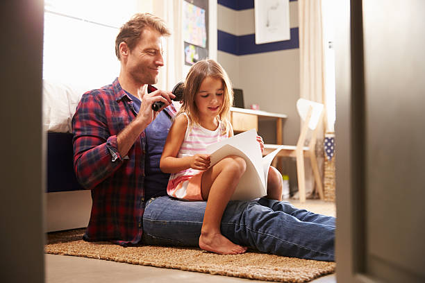 istock Father brushing young daughter's hair 477356594