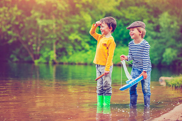istock Children with toy ship 477356820