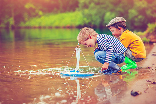 istock Children with toy ship 477356826